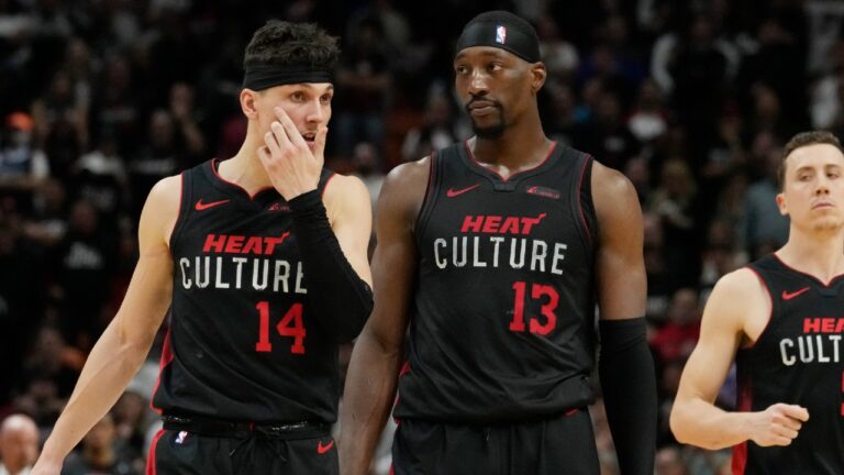 Miami Heat guard Tyler Herro (14) and center Bam Adebayo (13) talk on the court during the second half of an NBA basketball game, Friday, Jan. 19, 2024, in Miami. The Hawks defeated the Heat 109-108. (Marta Lavandier/AP)