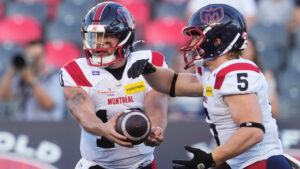 Montreal Alouettes quarterback Davis Alexander (10) hands the ball off to running back Travis Theis (5) during first half CFL action against the Ottawa Redblacks in Ottawa, Friday, July 31, 2026. (Adrian Wyld/CP)