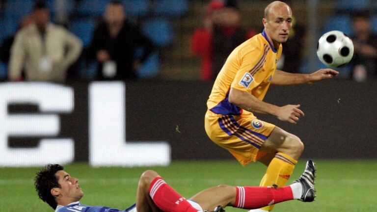 France's Yoann Gourcuff, left, challenges for the ball with Romania's Gabriel Muresan during their World Cup group 7 qualifying soccer match at Farul Stadium in Constanta, Romania Saturday, Oct. 11, 2008. (AP Photo/Francois Mori)