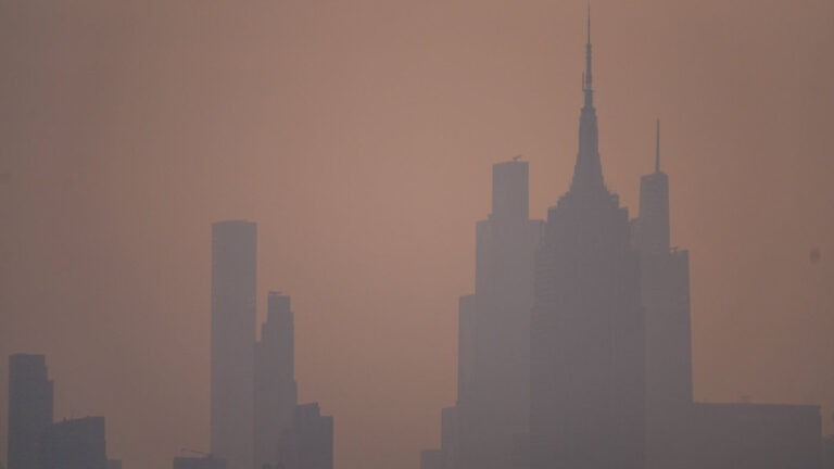 The New York City skyline is seen through a cover of wildfire smoke, in Jersey City, N.J., Friday, July 17, 2026. (Ryan Murphy/AP)