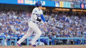 Los Angeles Dodgers' Shohei Ohtani heads to first for a solo home run during the first inning of a baseball game against the Colorado Rockies, Tuesday, July 7, 2026, in Los Angeles. (AP Photo/Mark J. Terrill)