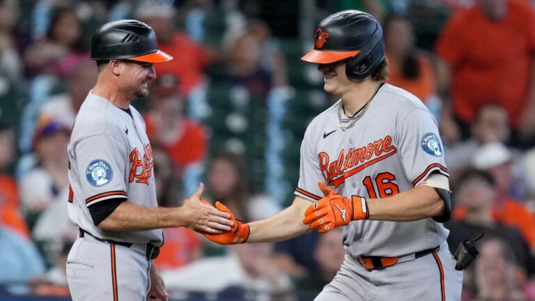 Baltimore Orioles' Coby Mayo, right, celebrates with third base coach Buck Britton, left, after hitting a solo home run during the sixth inning of a baseball game against the Houston Astros, Sunday, July 19, 2026, in Houston. (Eric Christian Smith/AP)