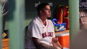 Boston Red Sox starting pitcher Eduardo Rivera sits in the dugout after being pulled from the game in the first inning during the second baseball game of a doubleheader against the Baltimore Orioles, Wednesday, July 22, 2026, in Boston. (Charles Krupa/AP)
