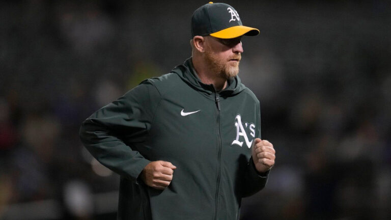 Athletics pitching coach Scott Emerson jogs during a baseball game against the Toronto Blue Jays in Oakland, Calif., Sept. 5, 2023. (Jeff Chiu/AP)