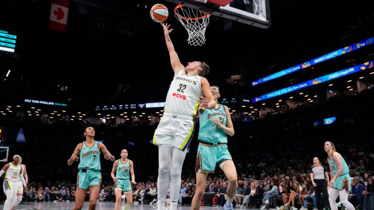 Dallas Wings forward Jessica Shepard (32) shoots during the first half of a WNBA basketball game against the New York Liberty, Tuesday, July 7, 2026, in New York. (AP Photo/Yuki Iwamura)
