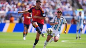 Spain's Aymeric Laporte (14) make a pass under pressure from Argentina's Julian Alvarez, right, during the World Cup final soccer match between Spain and Argentina in East Rutherford, N.J., near New York, Sunday, July 19, 2026. (AP Photo/Abbie Parr)
