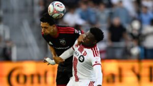 D.C. United midfield Andre Dozzell, left, heads the ball against Toronto FC midfield Derrick Etienne Jr., right, during the first half of an MLS soccer match, Saturday, July 25, 2026, in Washington. (John McDonnell/AP)