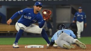 Tampa Bay Rays' Chandler Simpson (14) is forced out at second base by Toronto Blue Jays infielder Andres Gimenez, left during eighth inning MLB baseball action in Toronto on Monday, July 20, 2026. (Jon Blacker/CP)
