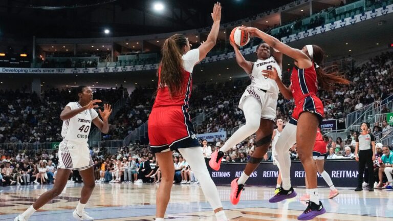 Toronto Tempo's Nyara Sabally (8) drives as Washington Mystics' Cotie McMahon (right) defends during first half WNBA basketball action in Toronto on Tuesday, July 14, 2026. (Chris Young/CP)