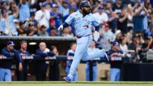 Toronto Blue Jays' Vladimir Guerrero Jr. heads home to score on a RBI-double hit by Alejandro Kirk against the San Diego Padres in the fourth inning of a baseball game Friday, July 10, 2026, in San Diego. (Derrick Tuskan/AP)