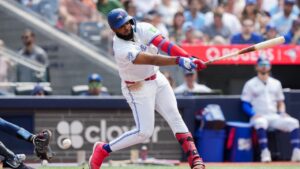 Toronto Blue Jays first baseman Vladimir Guerrero Jr. (27) swings through a strike while playing against the Tampa Bay Rays during third inning MLB baseball action in Toronto on Thursday, July 23, 2026. (Nathan Denette/CP)