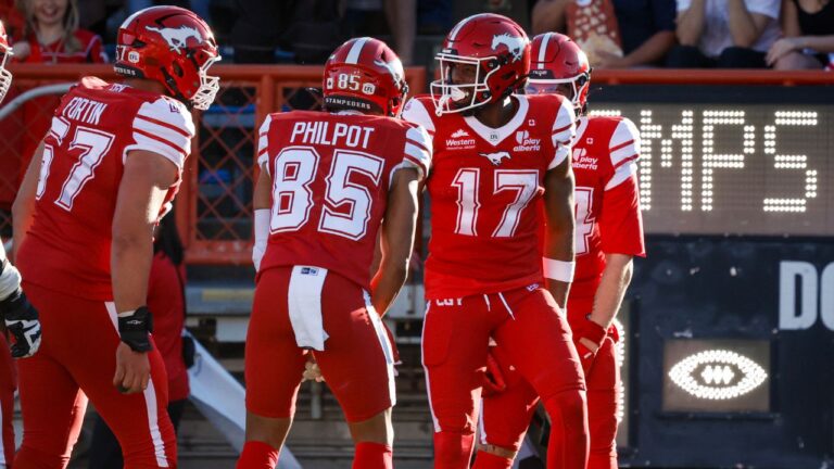 Calgary Stampeders' Dejon Brissett (17) celebrates his touchdown with teammates during first half CFL football action against the Toronto Argonauts in Calgary, Thursday, July 2, 2026.THE CANADIAN PRESS/Jeff McIntosh