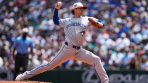 Toronto Blue Jays starting pitcher Shane Bieber throws against the Seattle Mariners during the first inning of a baseball game, Saturday, July 4, 2026, in Seattle. (AP Photo/Lindsey Wasson)