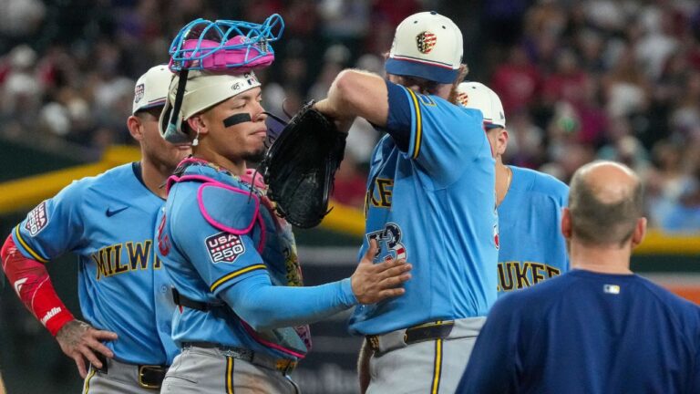 Milwaukee Brewers catcher William Contreras, left, consoles his pitcher Brandon Woodruff, right, before being taken out due to an injury in the fourth inning against the Arizona Diamondbacks Saturday, July 4, 2026, in Phoenix. (Darryl Webb/AP)