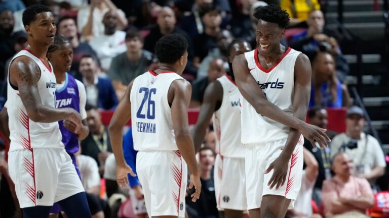 Washington Wizards' AJ Dybantsa, right, celebrates after a play against the Utah Jazz during the first half of an NBA Summer League basketball game Thursday, July 9, 2026, in Las Vegas. (AP Photo/John Locher)