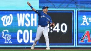 Toronto Blue Jays outfielder Daulton Varsho (5) plays a ball off the bat of Tampa Bay Rays' Junior Caminero off the wall for a double during first inning MLB baseball action in Toronto on Monday, July 20, 2026. THE CANADIAN PRESS/Jon Blacker