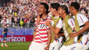 United States' Malik Tillman (17) celebrates with teammates after scoring on a free kick during the World Cup round of 32 soccer match between the United States and Bosnia in Santa Clara, Calif., near San Francisco, Wednesday, July 1, 2026. (AP Photo/Martin Meissner)