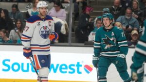 Edmonton Oilers center Connor McDavid (97) and San Jose Sharks center Macklin Celebrini (71) during an NHL hockey game in San Jose, Calif., Saturday, Feb. 28, 2026. (AP Photo/Jeff Chiu)