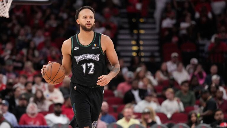 Minnesota Timberwolves forward Kyle Anderson (12) controls the ball against the Houston Rockets during the second half of an NBA basketball game, Friday, April 10, 2026, in Houston. (AP Photo/ Karen Warren)