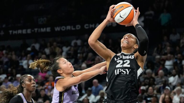 Las Vegas Aces star A'ja Wilson grabs a rebound over Golden State Valkyries' Kaitlyn Chen during a game on Sunday, June 21, 2026, in Las Vegas. (John Locher/AP)