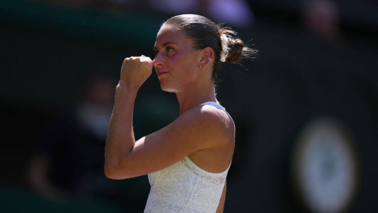 Marta Kostyuk of Ukraine celebrates a point against Jasmine Paolini of Italy, in their quarterfinal match at the Wimbledon Tennis Championships in London, Wednesday, July 8, 2026. (Brian Inganga/AP)