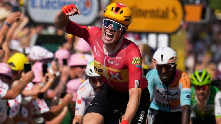Norway's Soren Waerenskjold celebrates as he crosses the finish line to win the eleventh stage of the Tour de France in Nevers, France, on Wednesday, July 15, 2026. (Mosa'ab Elshamy/AP)