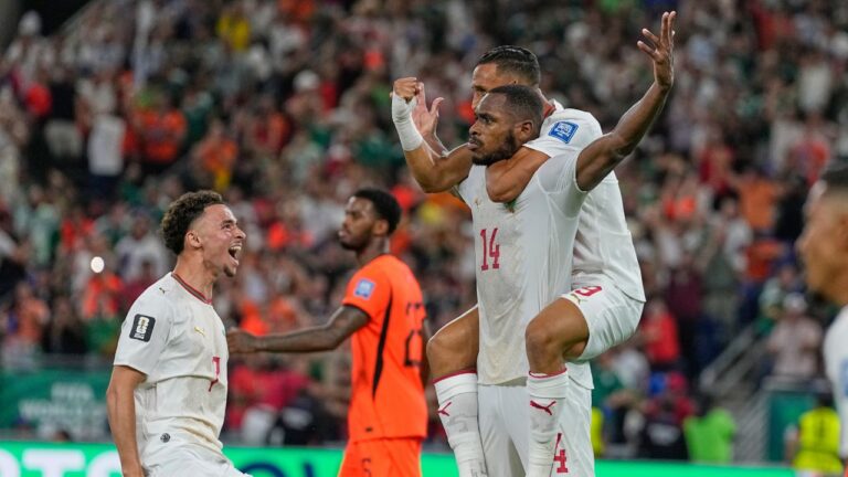 Morocco's Issa Diop (14) is congratulated by teammates Chemsdine Talbi (left) and Soufiane Rahimi (right) after a goal during the World Cup match between the Netherlands and Morocco in Guadalupe, near Monterrey, Mexico, Monday, June 29, 2026. (Ricardo Mazalan/AP)