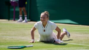 Amanda Anisimova of the United States gets up after falling down during a point against Sofia Kenin of the United States in their second round women's singles match at the Wimbledon Tennis Championships in London, Thursday, July 2, 2026. (AP Photo/Brian Inganga)