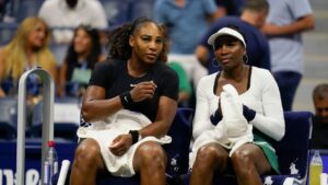 Serena Williams, left, and Venus Williams sit together during their first-round doubles match at the U.S. Open on Thursday, Sept. 1, 2022, in New York. (Charles Krupa/AP)
