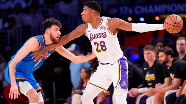 Rui Hachimura looks to pass while guarded by Chet Holmgren during the second half of Game 3 in a playoffs series on Saturday, May 9, 2026, in Los Angeles. (Mark J. Terrill/AP)
