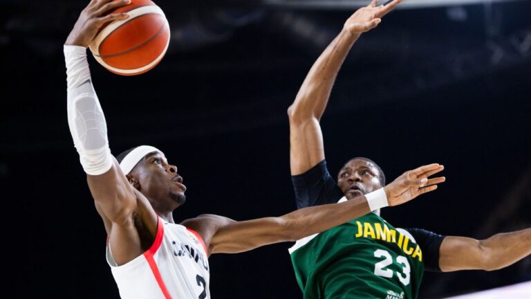 Shai Gilgeous-Alexander goes to the basket with pressure from Jamaica’s Tyran De Lattibeaudiere during FIBA action in Hamilton on Monday, July 6, 2026. (Nick Iwanyshyn/CP)