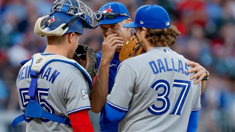 Toronto Blue Jays pitching coach Pete Walker speaks with pitcher Chad Dallas and catcher Tyler Heineman during the third inning of a baseball game against the Braves on Thursday, June 4, 2026, in Atlanta. (Erik S. Lesser/AP)