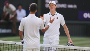 Novak Djokovic and Jannik Sinner at the end of their men's singles semifinal match at Wimbledon in London on Friday, July 10, 2026. (Kin Cheung/AP)
