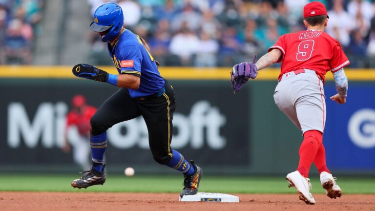 Seattle Mariners' Julio Rodríguez advances to third on a throwing error by Los Angeles Angels infielder Nolan Schanuel in the first inning of a baseball game Thursday, July 2, 2026, in Seattle. (Kevin Ng/AP)