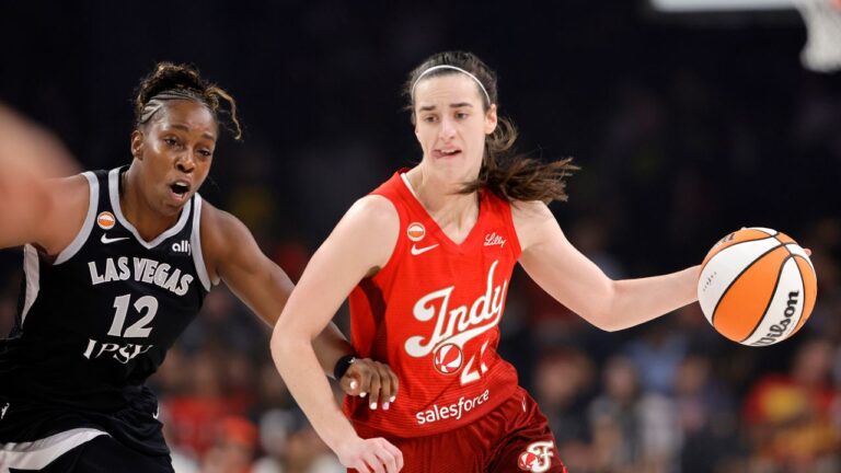 Indiana Fever guard Caitlin Clark (22) drives against Las Vegas Aces guard Chelsea Gray (12) during the first half of a WNBA basketball game Sunday, July 12, 2026, in Las Vegas. (Steve Marcus/AP)