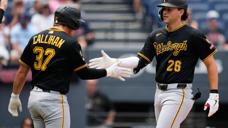Pittsburgh Pirates' Jacob Gonzalez (26) is congratulated by Tyler Callihan (37) as he crosses the plate with a home run in the second inning of the first baseball game of a split doubleheader against the Cleveland Guardians in Cleveland, Saturday, July 18, 2026. (Sue Ogrocki/AP)