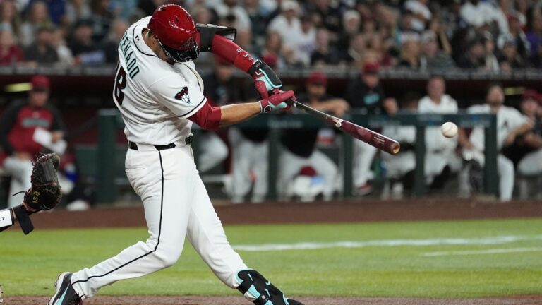 Arizona Diamondbacks' Nolan Arenado connects on a two-run double against the St. Louis Cardinals during the third inning of a baseball game, Saturday, July 18, 2026, in Phoenix. (Ross D. Franklin/AP)