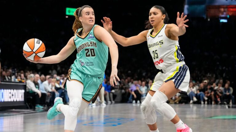 New York Liberty guard Sabrina Ionescu drives past Dallas Wings guard Azzi Fudd during the second half of a WNBA game, Tuesday, July 7, 2026, in New York. (Yuki Iwamura/AP)