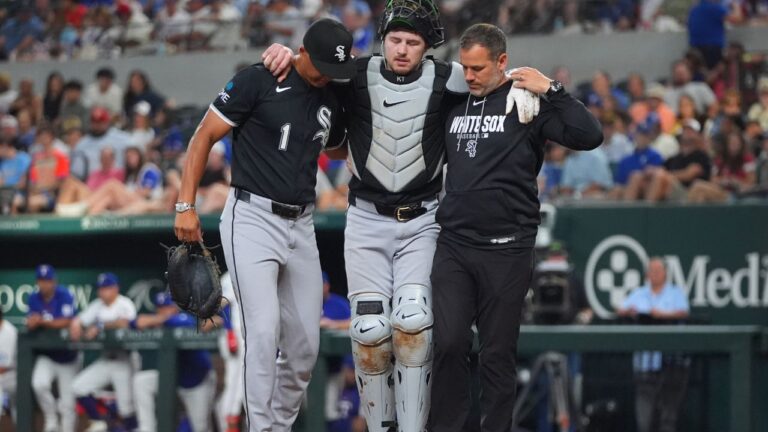 Kyle Teel is helped off the field during the second inning of a game against the Texas Rangers, Monday, July 20, 2026, in Arlington, Texas. (LM Otero/AP)