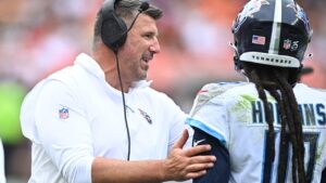 Mike Vrabel talks with DeAndre Hopkins during a game against the Cleveland Browns, Sunday, Sept. 24, 2023, in Cleveland. The Browns won 27-3. (David Richard/AP)