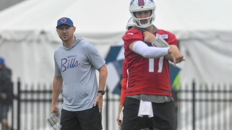 Buffalo Bills head coach Joe Brady, left, watches quarterback Josh Allen throw during practice at the team's training camp Wednesday, July 29, 2026, in Pittsford, N.Y. (Adrian Kraus/AP)