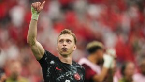 Canada's Alistair Johnston celebrates his team's win in the World Cup Group B match against Qatar in Vancouver, British Columbia, Thursday, June 18, 2026. (Abbie Parr/AP)