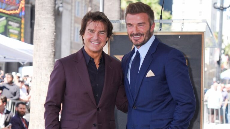 Tom Cruise, left, and David Beckham pose with Beckham's new star during a ceremony on the Hollywood Walk of Fame on Friday, June 12, 2026, in Los Angeles. (Chris Pizzello/AP)
