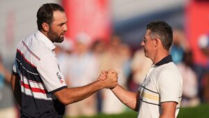 United States' Scottie Scheffler, left, celebrates after his win against Europe's Rory McIlroy on the 18th hole during their singles match on the Bethpage Black course at the Ryder Cup, Sunday, Sept. 28, 2025, in Farmingdale, N.Y. (Seth Wenig/AP)