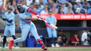 Toronto Blue Jays' Vladimir Guerrero Jr. (27) hits a double during first inning MLB baseball action against the Tampa Bay Rays in Toronto on Wednesday, July 22, 2026. (Nathan Denette/CP)