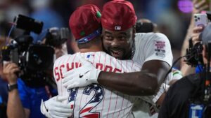 St. Louis Cardinals' Jordan Walker embraces Philadelphia Phillies' Kyle Schwarber after Walker won the MLB baseball All-Star Home Run Derby, Monday, July 13, 2026, in Philadelphia. (AP Photo/Matt Slocum)