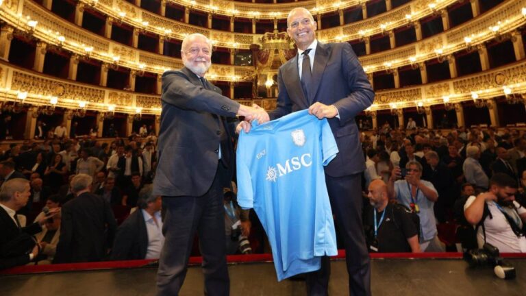 The new SSC Napoli coach, Massimiliano Allegri, right, holds a club's jersey with club president Aurelio De Laurentiis, during a presentation press conference at the San Carlo Theater, in Naples, Italy, Tuesday, July 14, 2026. (Alessandro Garofalo/LaPresse via AP)