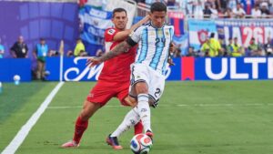 Argentina's Enzo Fernandez, front, controls a ball challenged by Switzerland's Remo Freuler during the World Cup quarterfinal soccer match in Kansas City, Mo., Saturday, July 11, 2026. (Jeff Roberson/AP Photo)