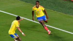 Colombia's Jhon Arias (11) celebrates with Daniel Munoz (2) after scoring their first goal during the World Cup round of 32 soccer match between Colombia and Ghana in Kansas City, Mo., Friday, July 3, 2026. (Reed Hoffmann/AP)