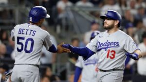 Los Angeles Dodgers' Max Muncy (13) celebrates after his two-run home run with Mookie Betts (50) during the seventh inning of a baseball game against the New York Yankees, Friday, July 17, 2026, in New York. (Adam Hunger/AP)